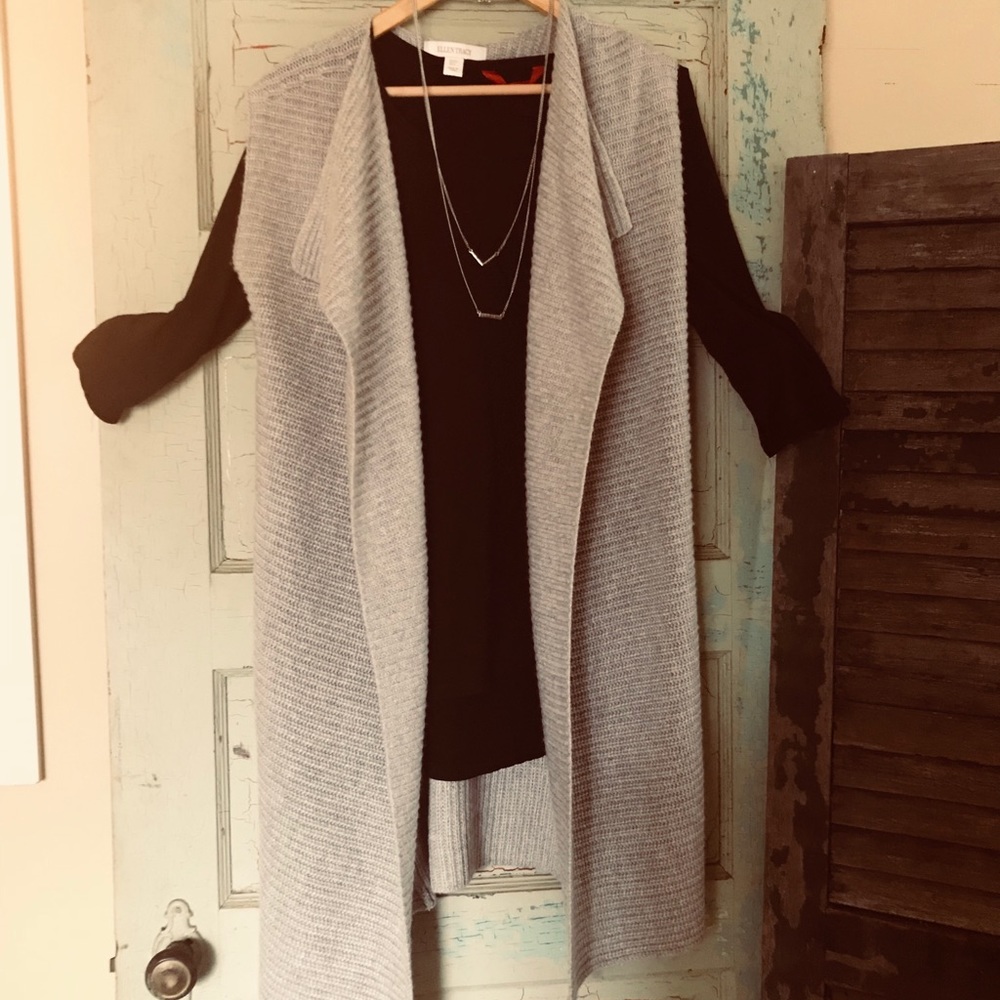 Long sleeveless sweater vest.